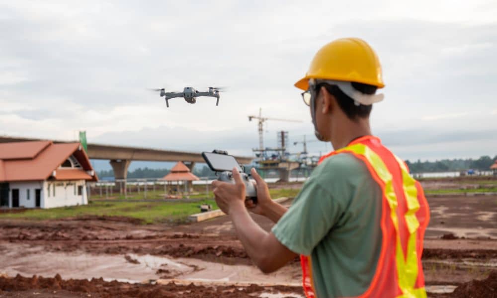 A land survey company using a drone to map an active construction site